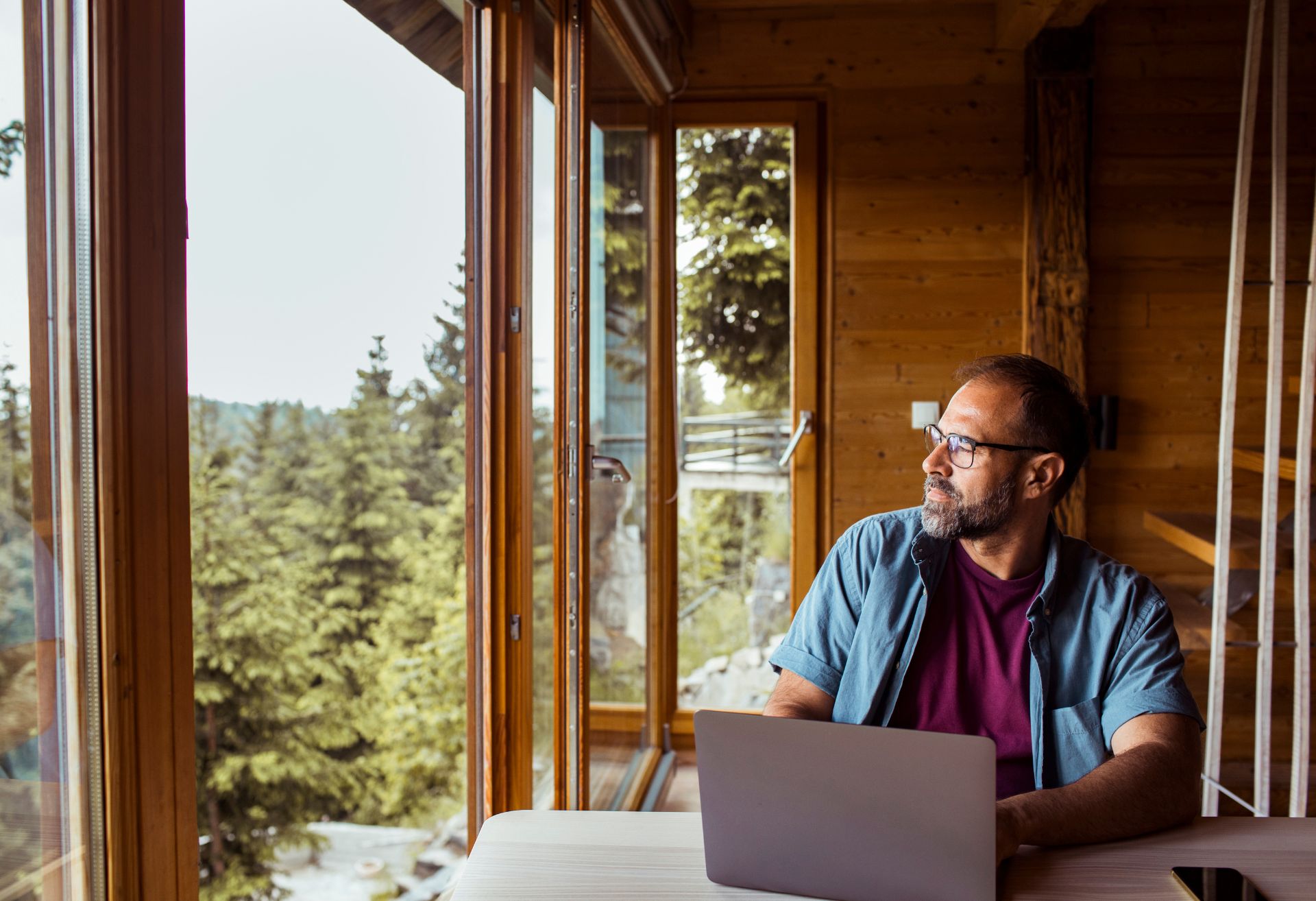 A man looking out of the window