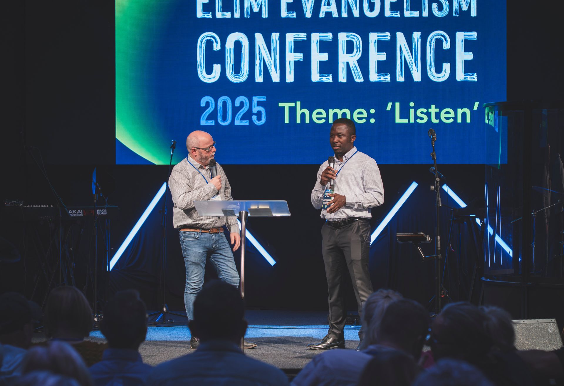 Photograph of Mark Greenwood on stage at the Evangelism Conference